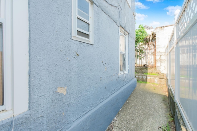 2123 W 9th St, Brooklyn, NY 11223 - view of home's exterior featuring stucco siding