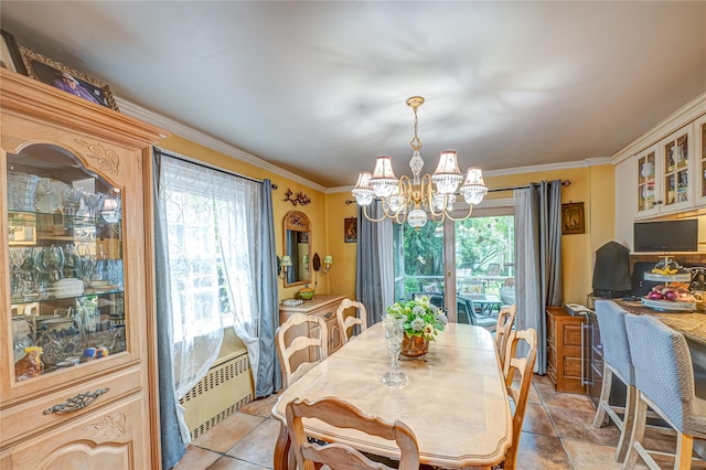 227 Elm St, West Hempstead, NY 11552 - dining space with a chandelier, plenty of natural light, ornamental molding, light tile patterned flooring, and a desk