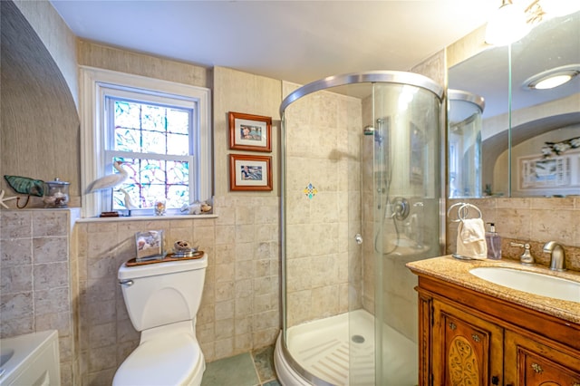 227 Elm St, West Hempstead, NY 11552 - full bath featuring tile walls, vanity, and a shower stall