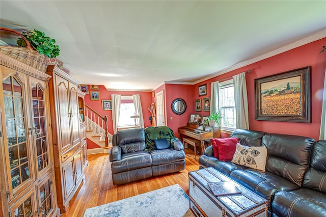 227 Elm St, West Hempstead, NY 11552 - living area featuring healthy amount of natural light, stairway, light wood-type flooring, and crown molding