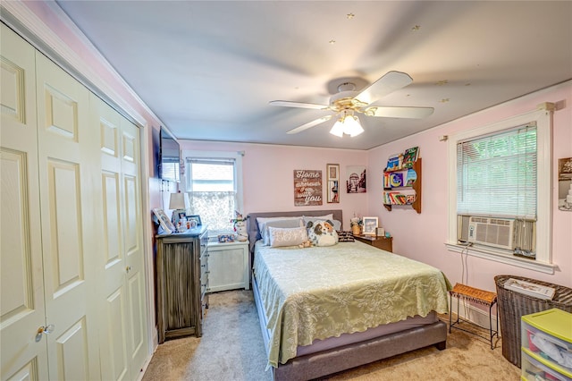 227 Elm St, West Hempstead, NY 11552 - bedroom with cooling unit, light colored carpet, a closet, and ceiling fan