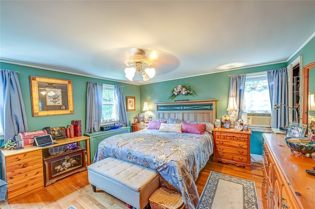 227 Elm St, West Hempstead, NY 11552 - bedroom featuring crown molding, multiple windows, light wood-type flooring, cooling unit, and a ceiling fan