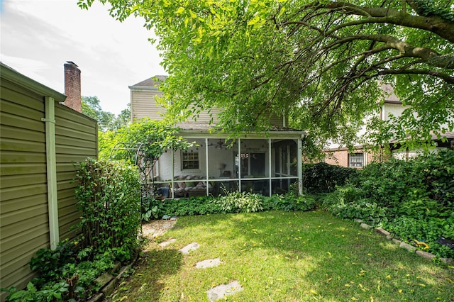 227 Elm St, West Hempstead, NY 11552 - view of grassy yard featuring a sunroom