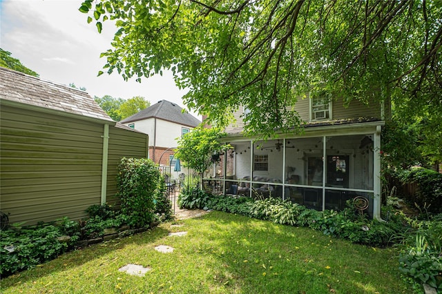 227 Elm St, West Hempstead, NY 11552 - view of grassy yard with a sunroom and a ceiling fan