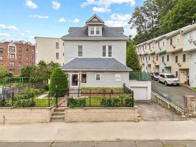 610 Van Cortlandt Park Ave, Yonkers, NY 10705 - american foursquare style home featuring a fenced front yard, roof with shingles, a gate, and a detached garage