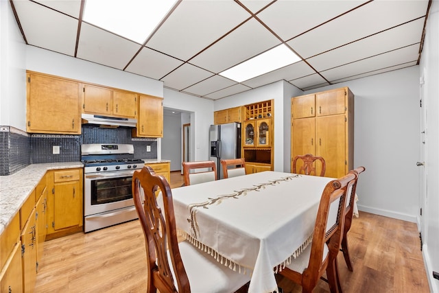 610 Van Cortlandt Park Ave, Yonkers, NY 10705 - dining area with light wood-style flooring and a paneled ceiling