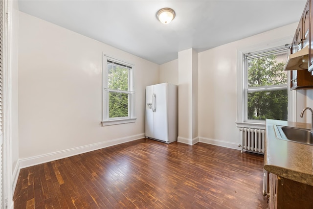 610 Van Cortlandt Park Ave, Yonkers, NY 10705 - empty room with radiator and dark wood-style floors