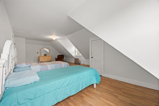 610 Van Cortlandt Park Ave, Yonkers, NY 10705 - bedroom with light wood-style flooring and vaulted ceiling