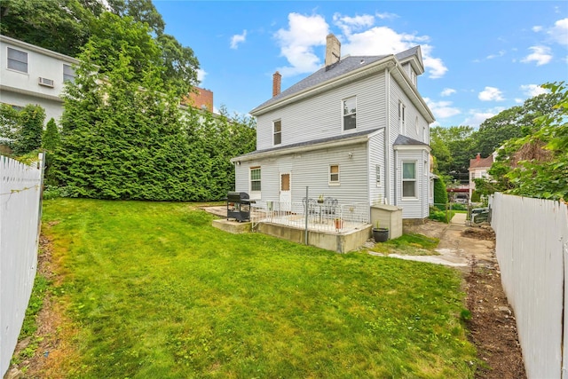 610 Van Cortlandt Park Ave, Yonkers, NY 10705 - back of property featuring a patio area and a chimney