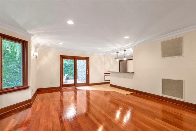 26 Vanderbilt Rd, Manhasset, NY 11030 - unfurnished living room with ornamental molding, recessed lighting, and light wood-style flooring