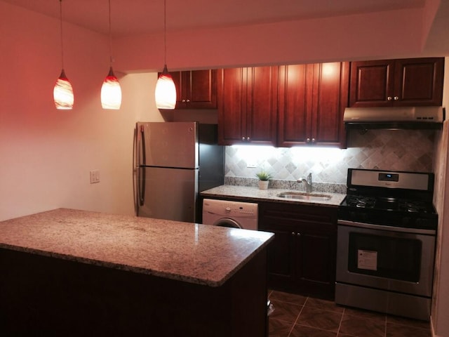 102-25 67th Rd Unit 5D, Forest Hills, NY 11375 - kitchen with stainless steel appliances, under cabinet range hood, washer / dryer, tasteful backsplash, and light stone counters