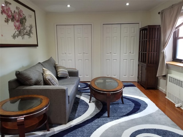 102-25 67th Rd Unit 5D, Forest Hills, NY 11375 - living room featuring wood finished floors, radiator, and recessed lighting