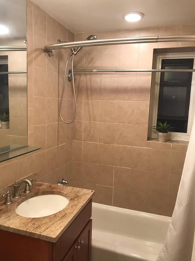 102-25 67th Rd Unit 5D, Forest Hills, NY 11375 - bathroom featuring vanity, shower / bathtub combination with curtain, and tasteful backsplash