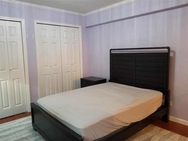 102-25 67th Rd Unit 5D, Forest Hills, NY 11375 - bedroom with wood finished floors, ornamental molding, and multiple closets