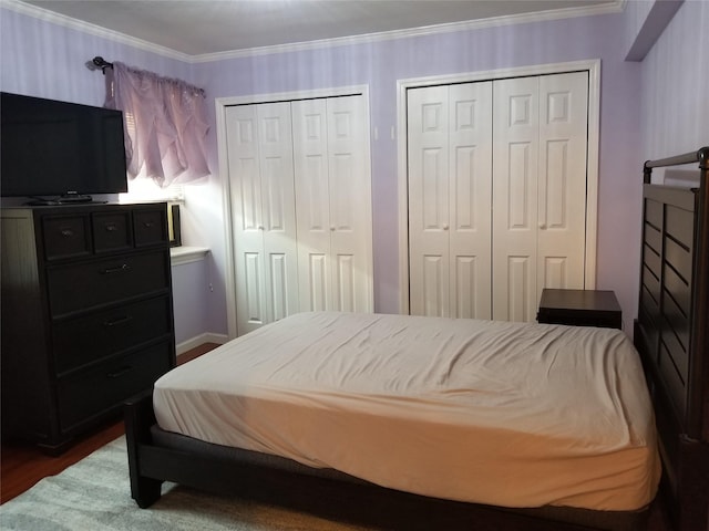 102-25 67th Rd Unit 5D, Forest Hills, NY 11375 - bedroom with multiple closets, dark wood-style floors, and ornamental molding