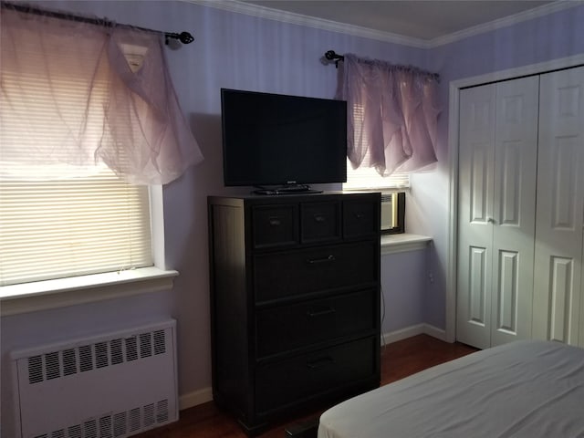 102-25 67th Rd Unit 5D, Forest Hills, NY 11375 - bedroom featuring radiator, a closet, ornamental molding, and dark wood finished floors