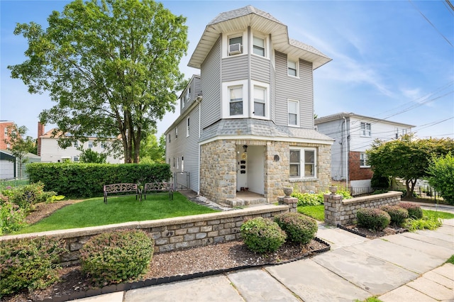 93 Edgewood Ave, Yonkers, NY 10704 - victorian-style house featuring stone siding and a front yard