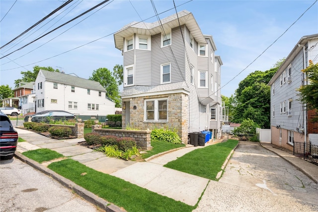 93 Edgewood Ave, Yonkers, NY 10704 - view of front facade with stone siding and driveway