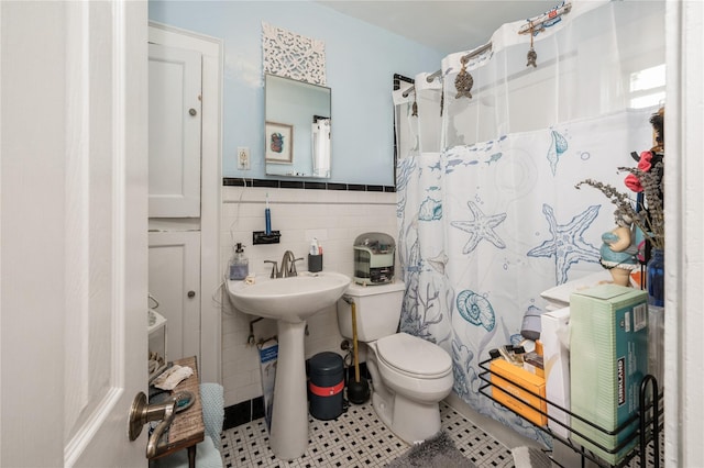 93 Edgewood Ave, Yonkers, NY 10704 - bathroom with tile walls, tile patterned flooring, a shower with curtain, and a wainscoted wall