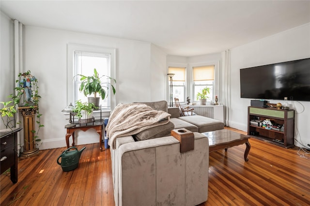 93 Edgewood Ave, Yonkers, NY 10704 - living room featuring radiator and hardwood / wood-style floors