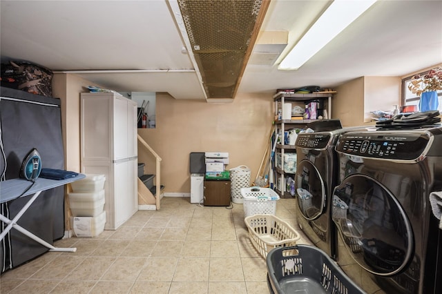 93 Edgewood Ave, Yonkers, NY 10704 - washroom featuring washing machine and clothes dryer and light tile patterned floors