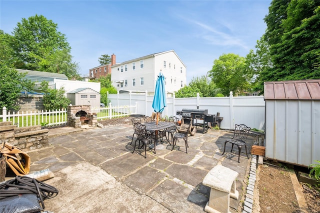 93 Edgewood Ave, Yonkers, NY 10704 - fenced backyard with a shed, a patio area, and outdoor dining area