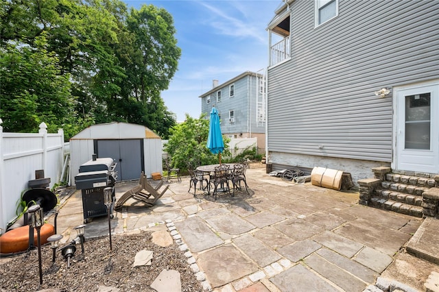 93 Edgewood Ave, Yonkers, NY 10704 - fenced backyard featuring a storage shed, a patio area, outdoor dining space, grilling area, and entry steps