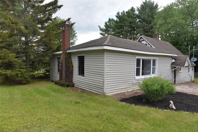 3216 State Route 42, Monticello, NY 12701 - view of property exterior with a chimney, a yard, and roof with shingles