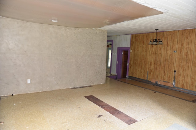 3216 State Route 42, Monticello, NY 12701 - empty room with tile patterned floors and wood walls