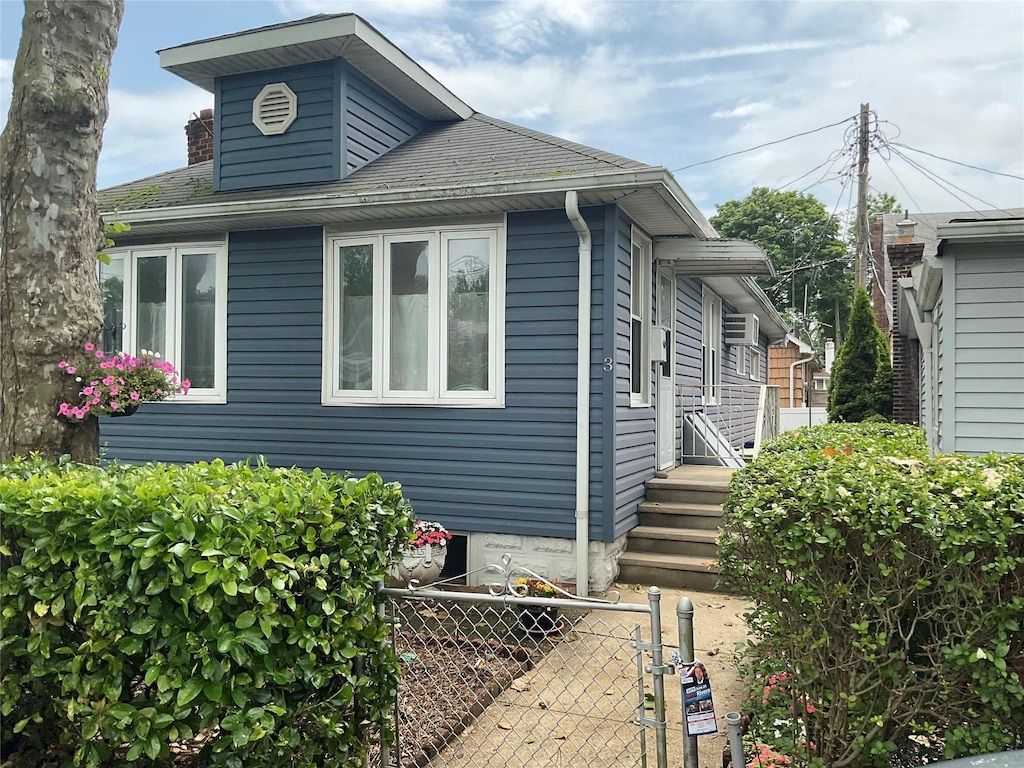 3 Acorn Pl Unit 3, Bronx, NY 10465 - view of side of property featuring a gate and roof with shingles