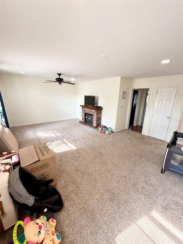 82-09 268th St Apt B, New Hyde Park, NY 11040 - living area featuring carpet floors, ceiling fan, a glass covered fireplace, and recessed lighting
