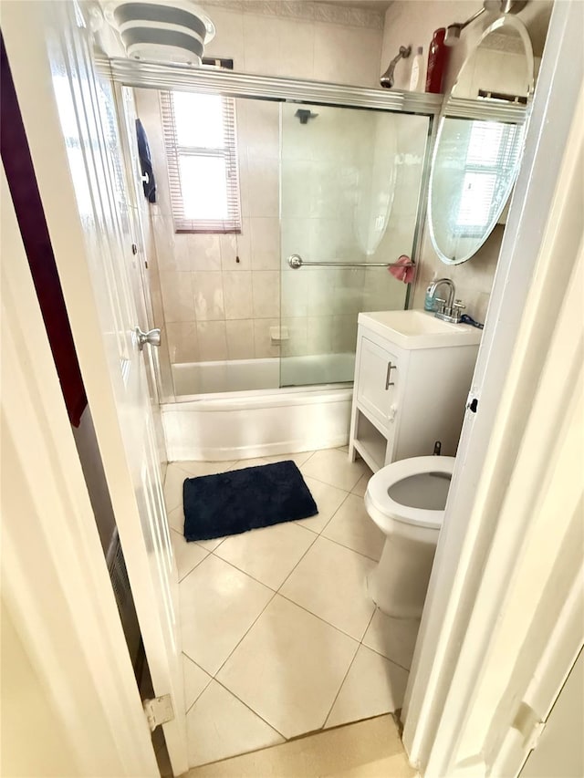 82-09 268th St Apt B, New Hyde Park, NY 11040 - full bathroom with tile patterned flooring, combined bath / shower with glass door, and vanity