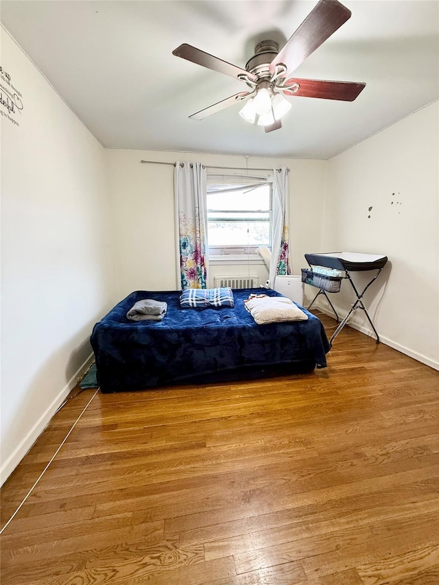 82-09 268th St Apt B, New Hyde Park, NY 11040 - bedroom with wood finished floors and a ceiling fan