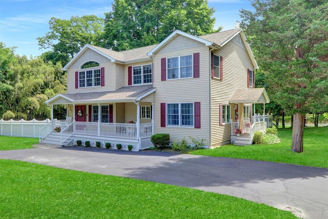1 Willis Ave, Port Jefferson, NY 11777 - view of front of house with covered porch, a shingled roof, and asphalt driveway