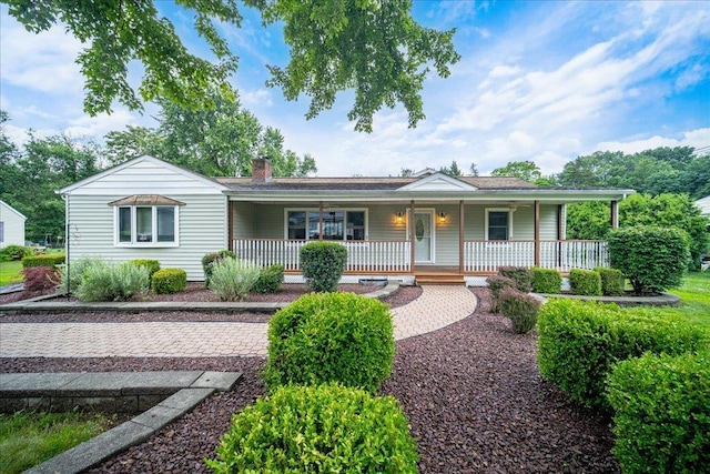 64 Mountainview Rd, Fishkill, NY 12524 - view of front of house featuring a porch and a chimney