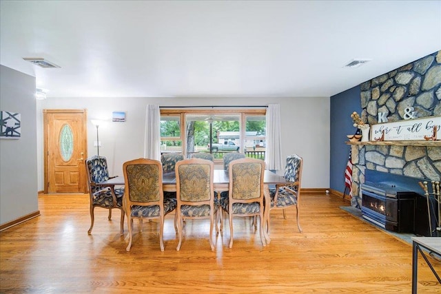 64 Mountainview Rd, Fishkill, NY 12524 - dining space with light wood-style floors and a fireplace