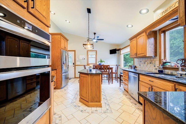64 Mountainview Rd, Fishkill, NY 12524 - kitchen featuring stainless steel appliances, lofted ceiling, a kitchen island, recessed lighting, and decorative backsplash