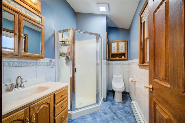 64 Mountainview Rd, Fishkill, NY 12524 - bathroom featuring a baseboard heating unit, tile walls, tile patterned floors, vanity, and a stall shower