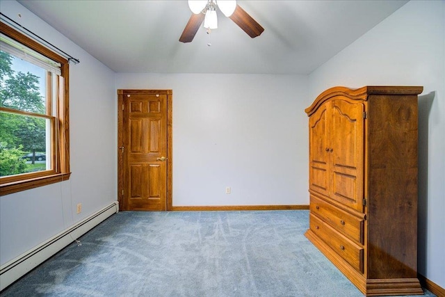 64 Mountainview Rd, Fishkill, NY 12524 - unfurnished bedroom featuring a baseboard heating unit, carpet flooring, and ceiling fan