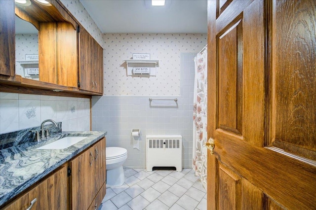 64 Mountainview Rd, Fishkill, NY 12524 - bathroom featuring radiator heating unit, wallpapered walls, tile patterned flooring, vanity, and a wainscoted wall