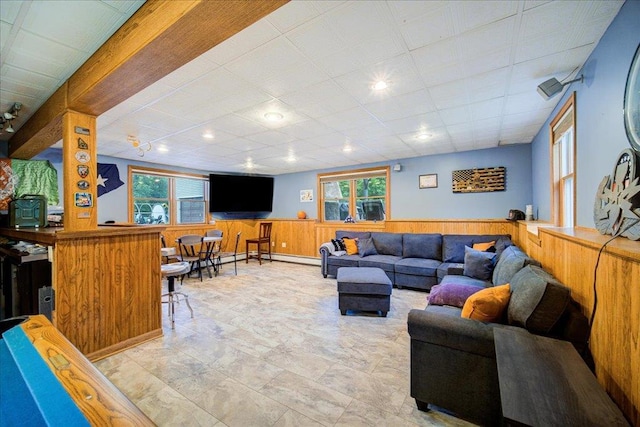 64 Mountainview Rd, Fishkill, NY 12524 - living area with healthy amount of natural light, wainscoting, and wooden walls