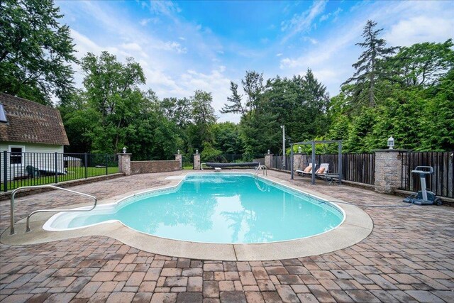 64 Mountainview Rd, Fishkill, NY 12524 - view of swimming pool featuring a patio area and view of wooded area