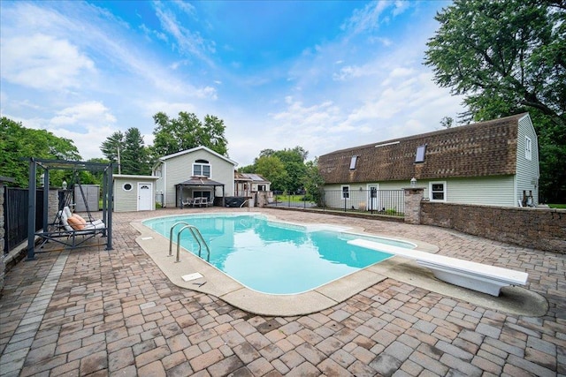 64 Mountainview Rd, Fishkill, NY 12524 - view of swimming pool featuring a patio area, an outbuilding, a diving board, and a gazebo