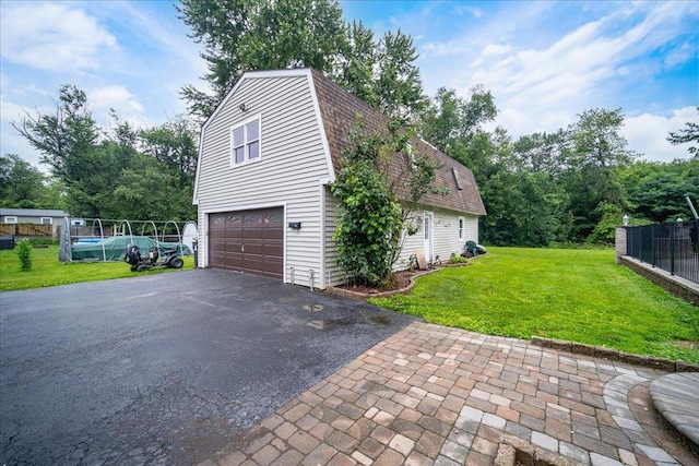 64 Mountainview Rd, Fishkill, NY 12524 - view of side of home with a gambrel roof, driveway, a garage, a shingled roof, and a pool