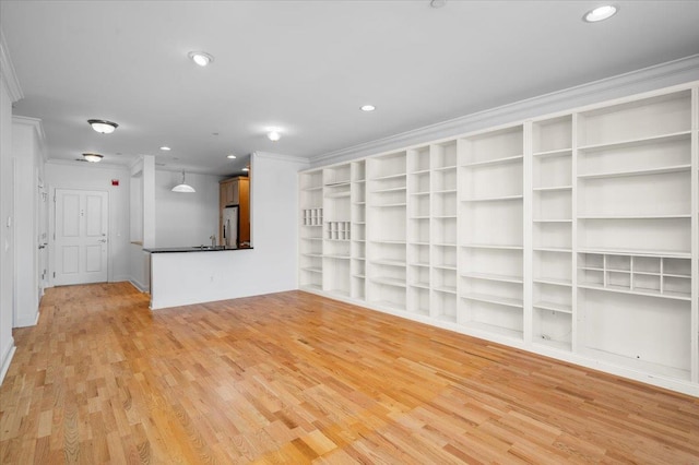 55 1st St Unit 207, Pelham, NY 10803 - unfurnished living room featuring crown molding, light wood finished floors, and recessed lighting