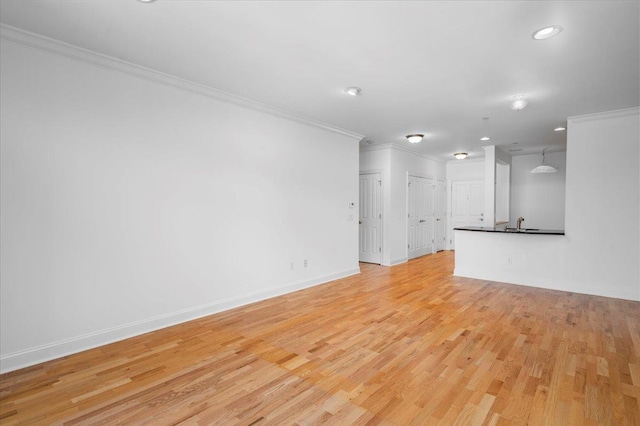 55 1st St Unit 207, Pelham, NY 10803 - unfurnished living room featuring light wood-style floors, ornamental molding, and recessed lighting
