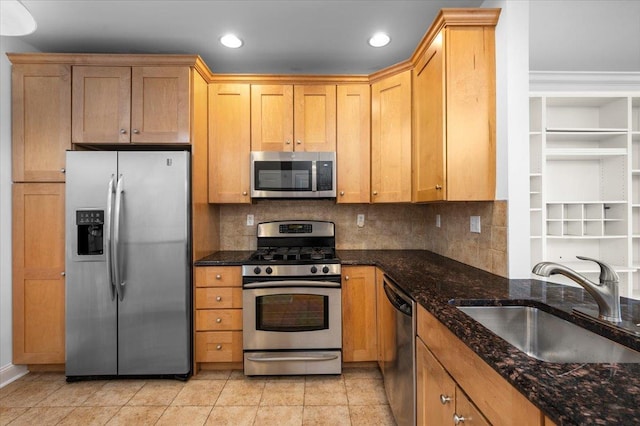 55 1st St Unit 207, Pelham, NY 10803 - kitchen featuring stainless steel appliances, decorative backsplash, dark stone countertops, recessed lighting, and light tile patterned flooring