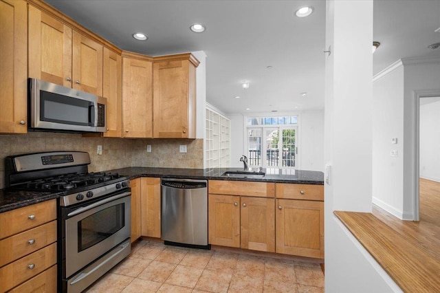 55 1st St Unit 207, Pelham, NY 10803 - kitchen with stainless steel appliances, recessed lighting, decorative backsplash, dark stone counters, and crown molding