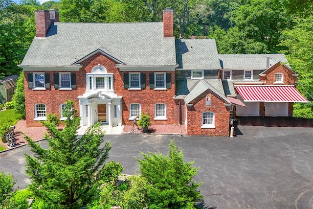 400 Beechmont Dr, New Rochelle, NY 10804 - colonial house with a chimney and brick siding