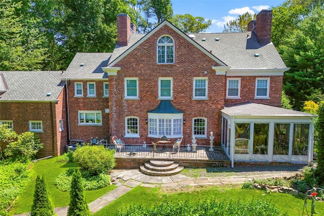 400 Beechmont Dr, New Rochelle, NY 10804 - back of property with a chimney, a sunroom, brick siding, and a yard